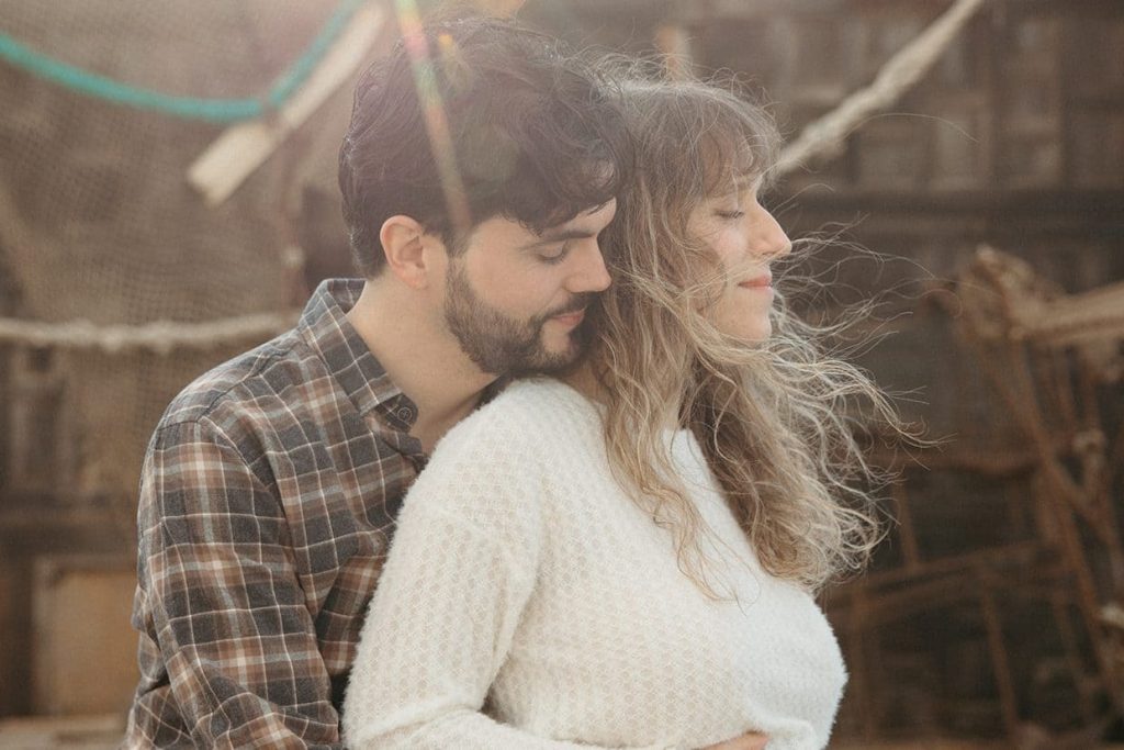 Vicente hugging Naira at the beach.
